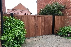 Custom sapele hardwood gates treated brown